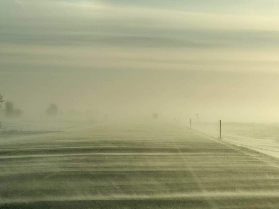 Blowing snow reduces visibility on the Trans-Canada Highway between Portage la Prairie and Elie as strong southerly winds move through the region. PortageOnline/Chris Kitchen